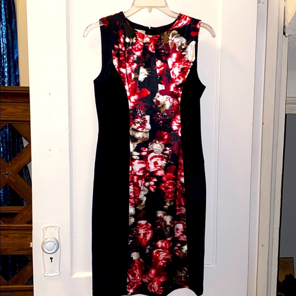 Black fitted business casual dress with flowers.